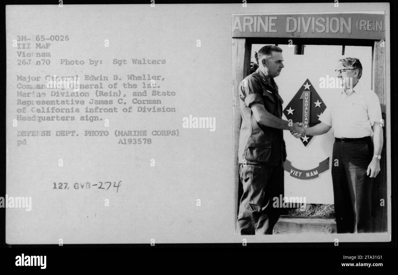 Major General Edwin B. Wheeler, Commanding General of the 1st Marine Division (Rein), and California State Representative James C. Corman pictured in front of the Division Headquarters sign during a meeting on January 26, 1970. Photo taken by Sgt. Walters. This photo is part of a series documenting American military activities during the Vietnam War. Defense Department photo (Marine Corps). Stock Photo