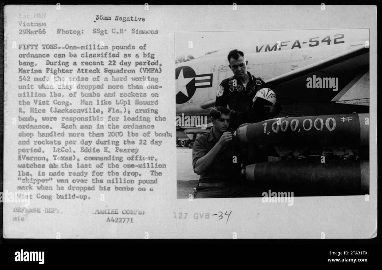 Lieutenant Eddie E. Pearcy overseeing the loading of one-million pounds of ordnance by Marine Fighter Attack Squadron (VMFA) 542 during a 22-day period in Vietnam, March 29, 1966. LCpl Howard R. Hice from Jacksonville, Florida, an ordnance technician, loaded over 2000 lbs of bombs and rockets daily. LtCol. Pearcy celebrating as the squadron surpassed the one-million pound mark. (Defense Department, Marine Corps) A422771 127 GVB-34 VMFA-542. Stock Photo