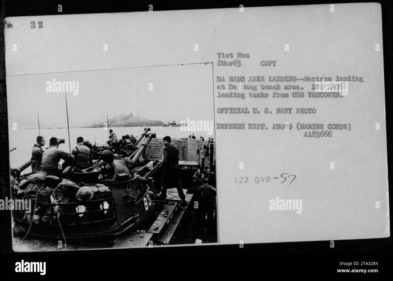 Marines landing at Da Nang beach area, with LPU 1476 landing tanks from USS Vancouver, during the Vietnam War on March 8, 1965. This official U.S. Navy photograph captures the military activities taking place in the area. Stock Photo