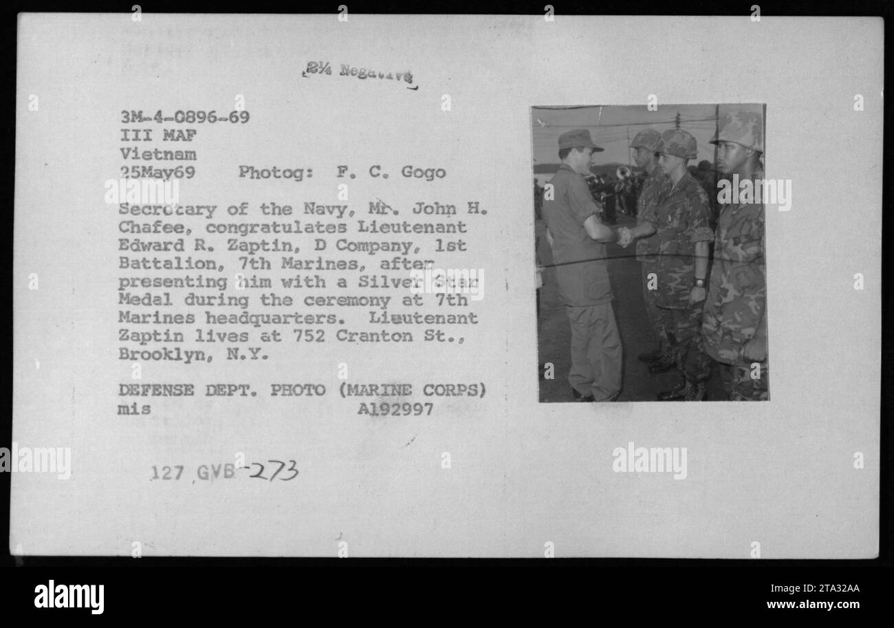 'Secretary of the Navy, Mr. John H. Chafee, congratulates Lieutenant Edward R. Zaptin, D Company, 1st Battalion, 7th Marines, after presenting him with a Silver Star Medal at the 7th Marines headquarters. Lieutenant Zaptin is from Brooklyn, NY. Photo taken on May 25, 1969, during the Vietnam War.' Stock Photo