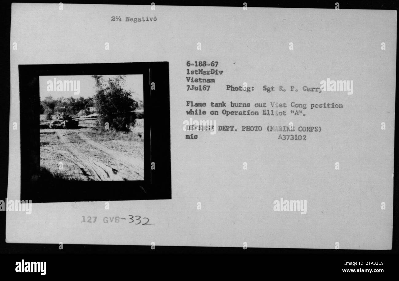 A flame tank belonging to the 1st Marine Division burns out a Viet Cong ...