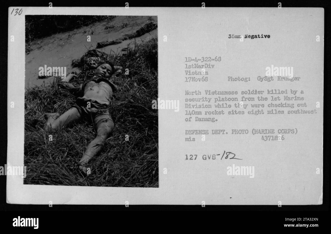 'Image showing a deceased North Vietnamese soldier killed by a security platoon from the 1st Marine Division during a mission to investigate rocket sites near Danang on November 17, 1968. This 35mm negative photograph was captured by GySgt. Krueger, and was taken as part of American military activities during the Vietnam War.' Stock Photo