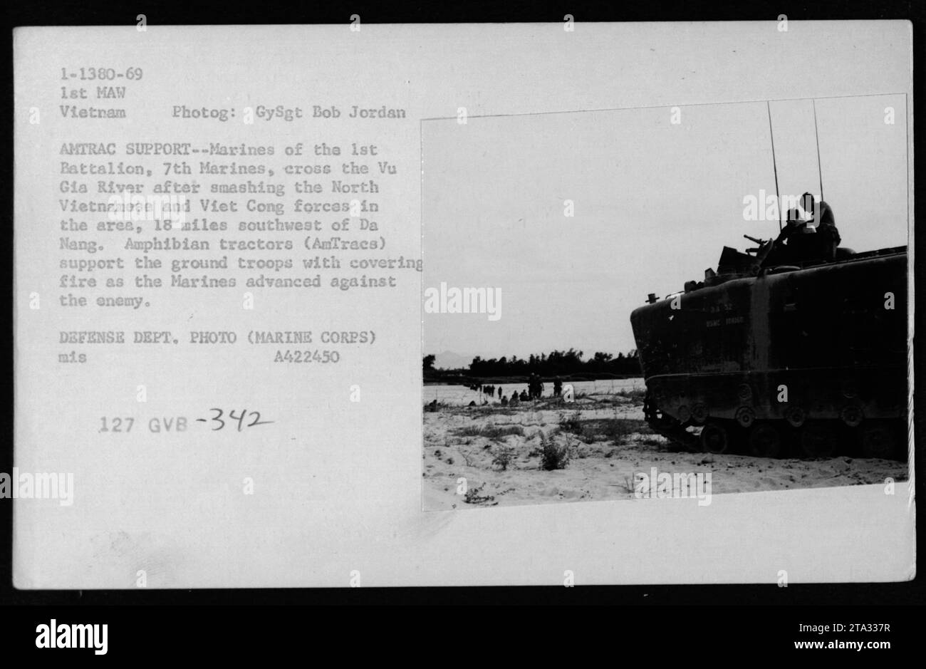 Marines from the 1st Battalion, 7th Marines, are seen crossing the Vu Gia River in Vietnam with support from amphibian tractors (AmTracs). The Marines had just defeated North Vietnamese and Viet Cong forces 18 miles southwest of Da Nang. The AmTracs provided covering fire as the Marines advanced against the enemy. Stock Photo