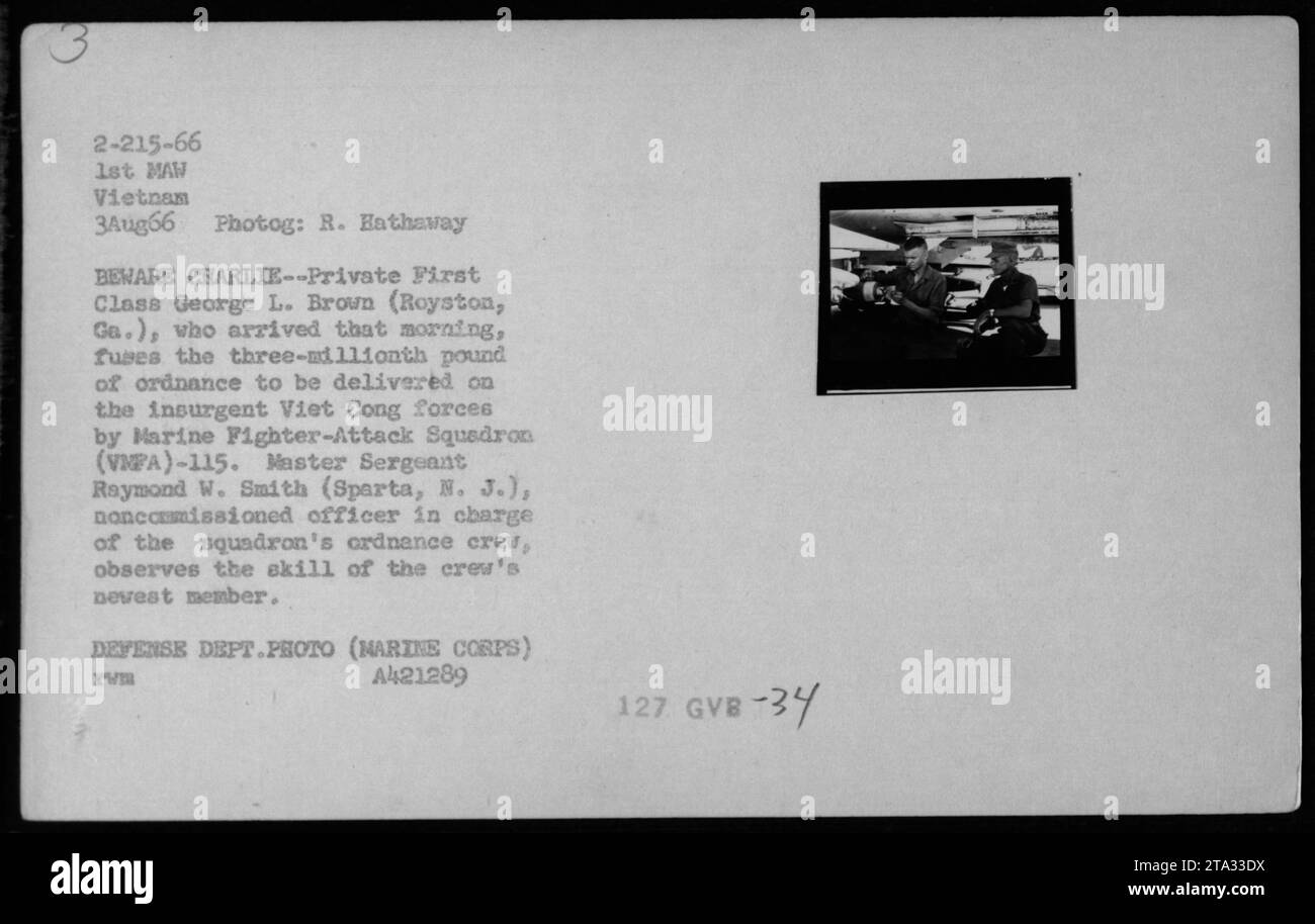 Private First Class George L. Brown from Royston, Georgia, fuses the three-millionth pound of ordnance for delivery on the Viet Cong forces by Marine Fighter-Attack Squadron (VNPA)-115. Master Sergeant Raymond W. Smith from Sparta, New Jersey, observes the skill of the squadron's newest member. This photograph was taken on August 3, 1966 in Vietnam. Stock Photo