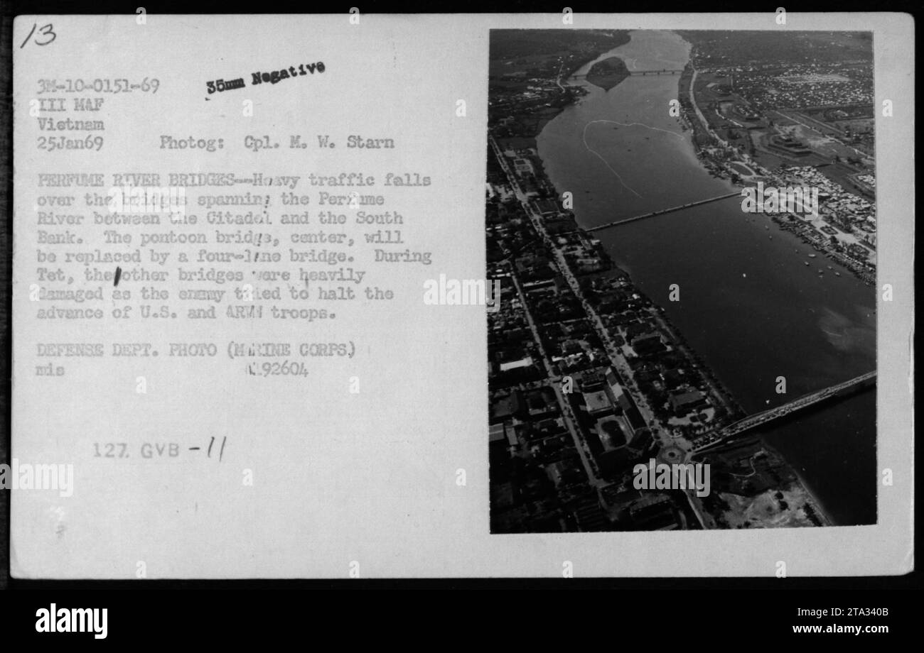 Aerial photo of Hue taken on January 25, 1969. The Perfume River Bridges can be seen, with heavy traffic passing over them. The pontoon bridge in the center of the image will soon be replaced by a four-lane bridge. During the Tet Offensive, the other bridges were heavily damaged as the enemy attempted to impede the progress of U.S. and ARM troops. This photo was taken by Cpl. M. W. Starn and is a Defense Department photo (Marine Corps), with reference number L.92604 127. (Courtesy of National Archives and Records Administration) Stock Photo