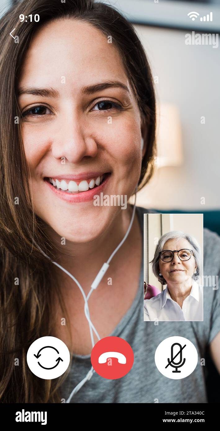 Senior mother and daughter talking on video call. POV screen of online conference on mobile phone app Stock Photo