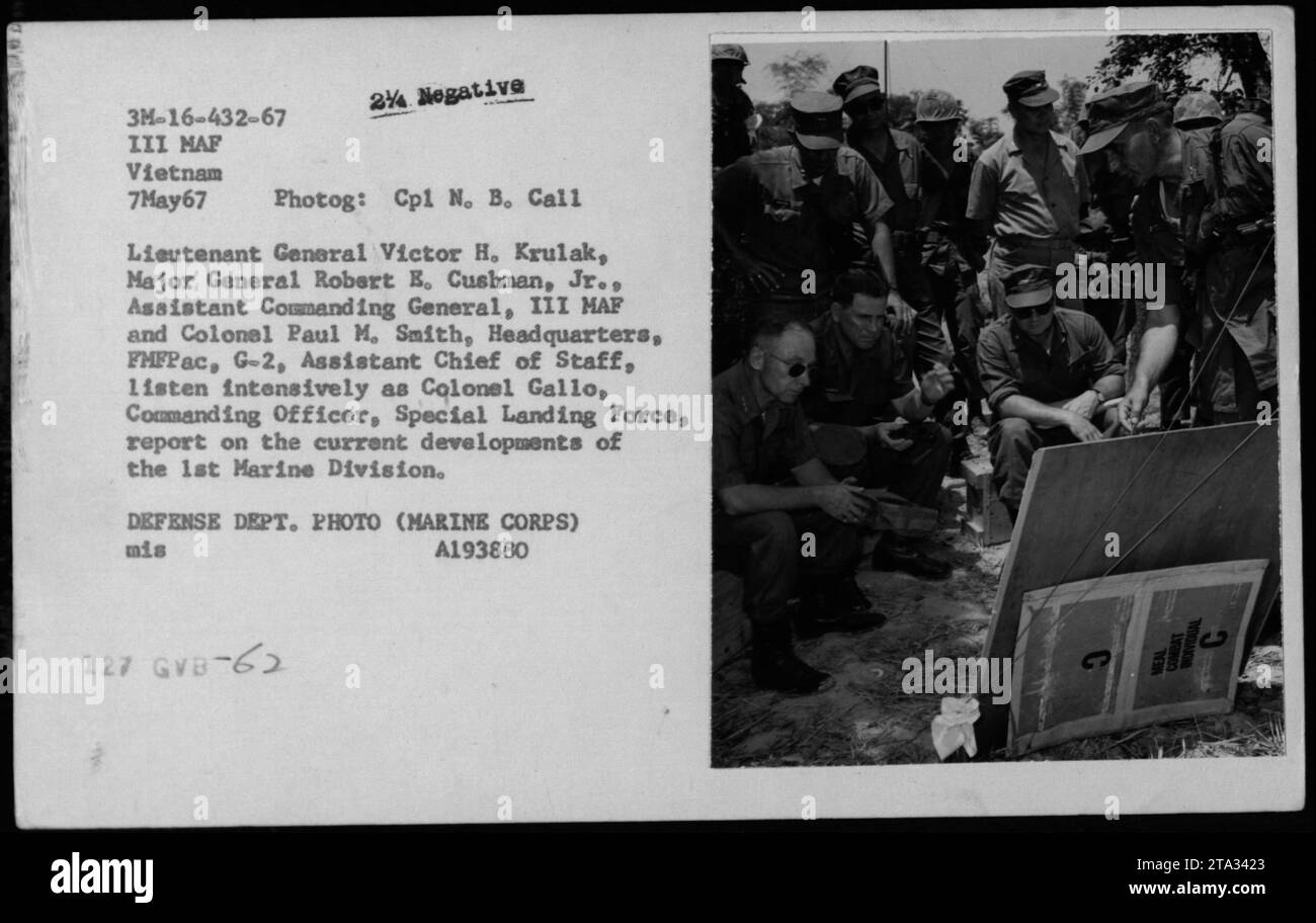 Lieutenant General Victor H. Krulak, Major General Robert E. Cushman, Jr., and Colonel Paul M. Smith attentively listen to Colonel Gallo, Commanding Officer, Special Landing Force, giving a report on the current developments of the 1st Marine Division during a briefing on May 7, 1967, in Vietnam. (Photo credit: US Department of Defense) Stock Photo