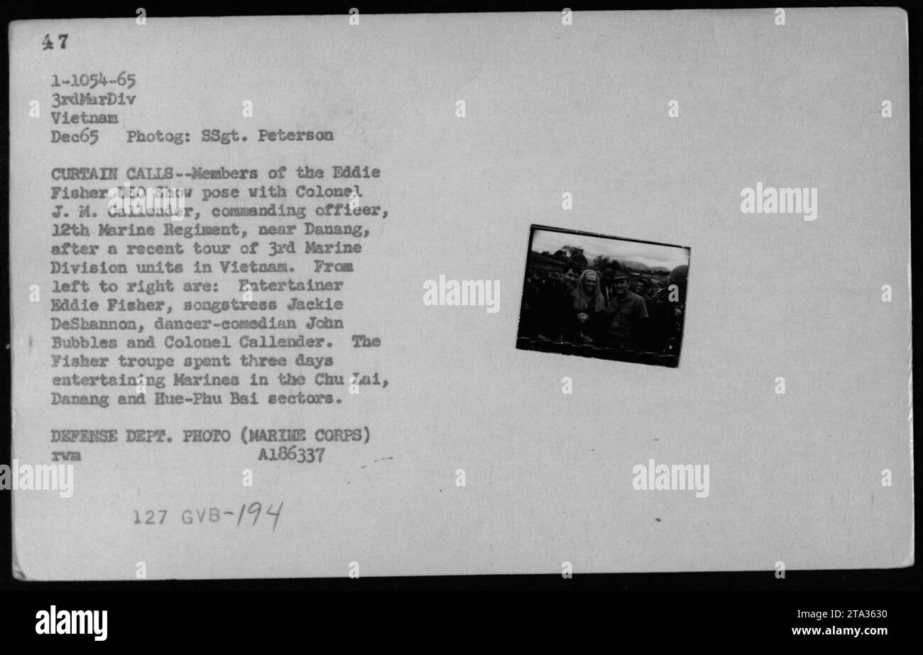 Entertainers Eddie Fisher, Jackie DeShannon, John Bubbles and Colonel J. M. Callender pose for a photo near Danang after a USO show in Vietnam. The Eddie Fisher USO Show spent three days entertaining Marines in the Chu Lai, Danang and Hue-Phu Bai sectors. The photo was taken in December 1965. Stock Photo