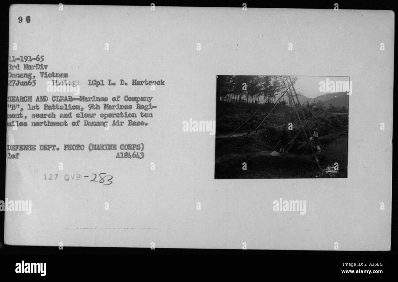 Marines from Company B, 1st Battalion, 9th Marines Regiment conducting a search and clear operation ten miles northwest of Danang Air Base. The photograph was taken on June 27, 1965 by ICpl Le De Hartsock and is an official Defense Department photo (Marine Corps) with the identification code 11-191-65 Brd MarDiv Daneng. Stock Photo
