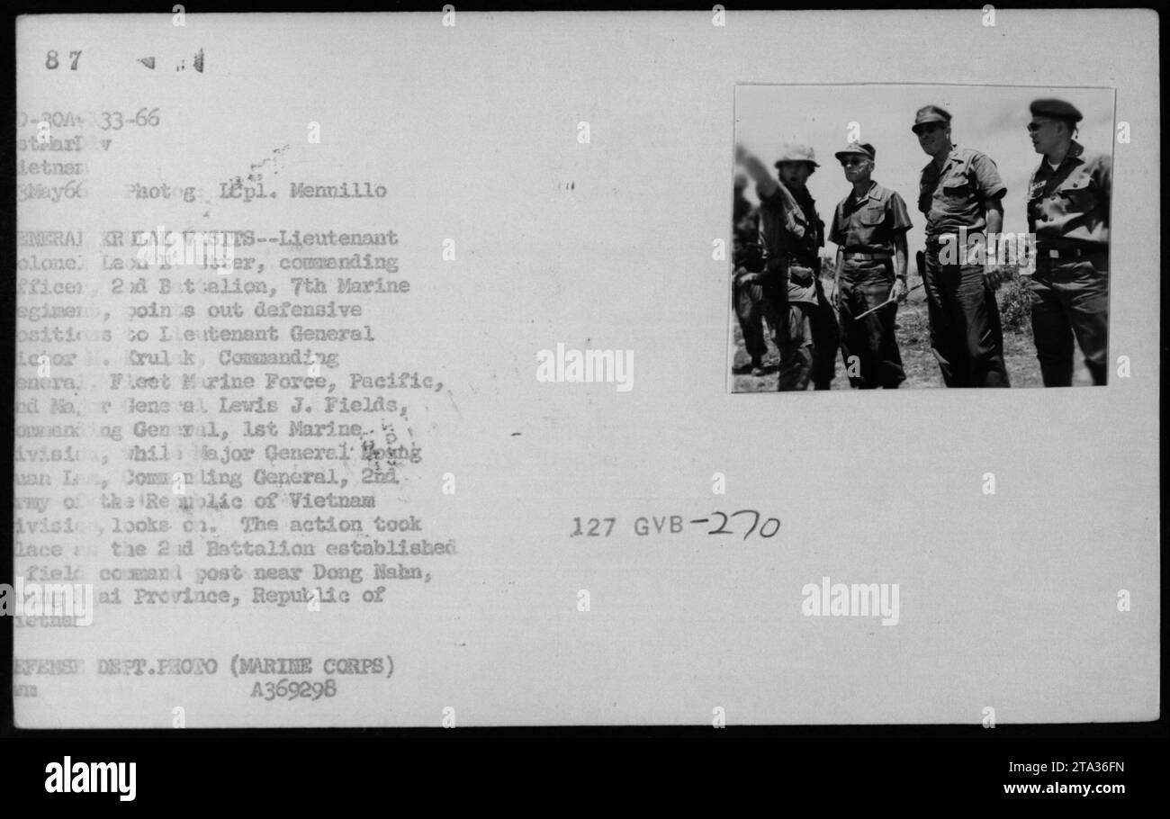 Lt. Col. Leon Utter discusses defensive positions with Lt. Gen. Letor ...