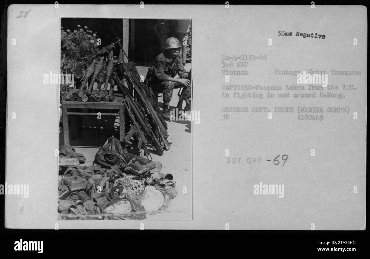 A photograph showing a collection of captured weapons taken from the Viet Cong (V.C.) during combat operations in and around Dellang during the Vietnam War. The photo is a 35mm negative taken by Gysgt Thompson, a Marine Corps photographer, in 1968. It was labeled as 'EATYTAT 30-ly-0153-68 3rd MAP Vietnam' with the Defense Department photo code 'jb A190445 127 GVB-69'. Stock Photo