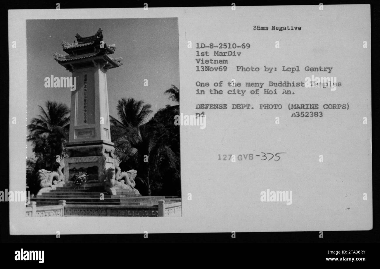 'A Buddhist temple in the city of Hoi An, Vietnam during the Vietnam War. This photograph, taken by Lepl Gentry on November 13, 1969, captures the daily life of Vietnamese civilians amidst the ongoing conflict. The image showcases the resilience and persistence of local communities in the face of war.' Stock Photo