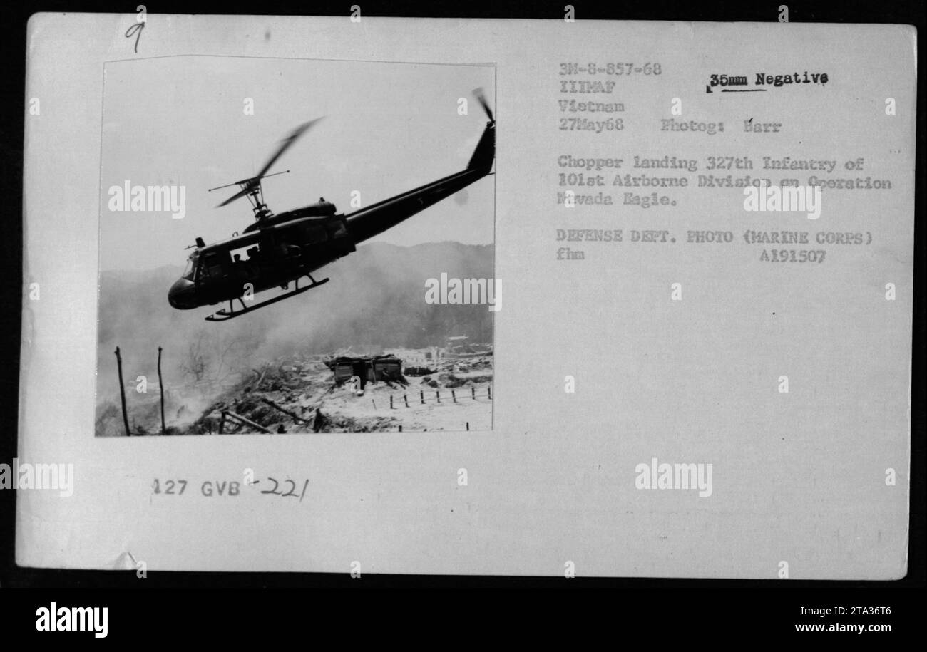 A UH-1 helicopter from May 27, 1968, is seen landing. This image captures a chopper from the 327th Infantry of the 101st Airborne Division on Operation Nevada Eagle in Vietnam. The photograph, taken by Harr, shows military activities during the Vietnam War. This photo is from the Defense Department and is a 35mm negative. Stock Photo