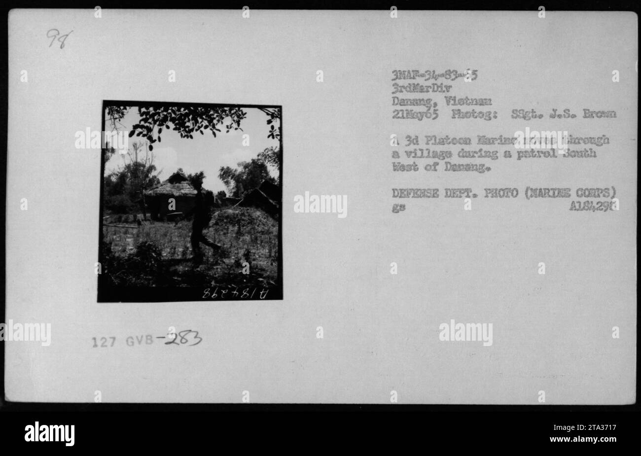 On May 21, 1965, a platoon of Marines patrols a village southwest of Da ...
