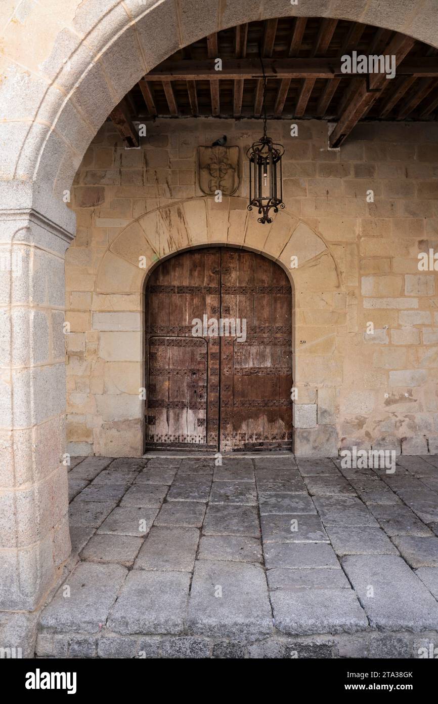 Facade of historic stone house with antique wooden door in the old town ...