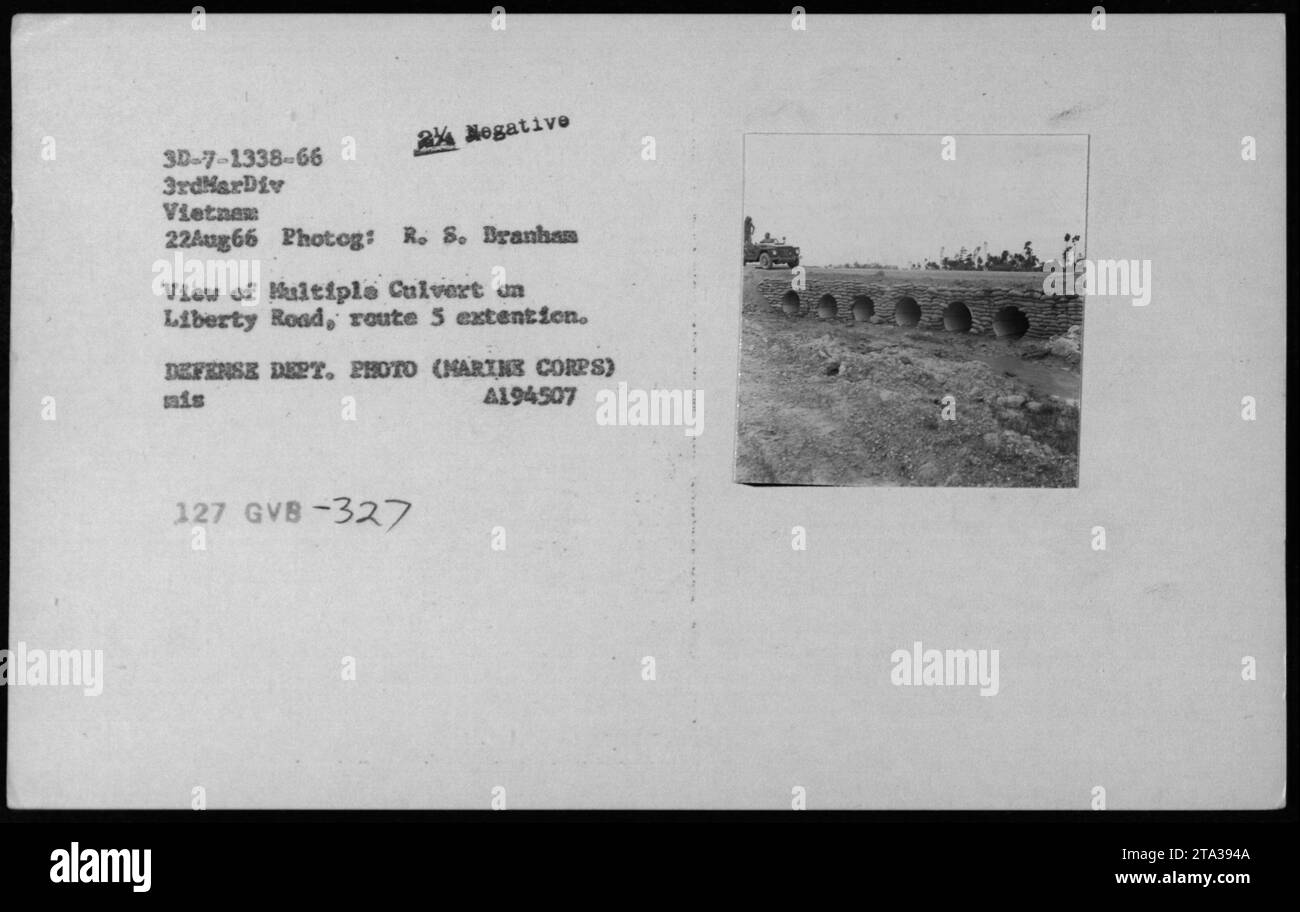 USMC and Vietnamese buildings and bunkers along Liberty Road, route 5 extension, can be seen in this photo taken on August 22nd, 1966. The image depicts multiple culverts, highlighting the structures present during military activities in Vietnam. The photograph was taken by R. S. Branhas and is part of the Defense Department's collection. Stock Photo