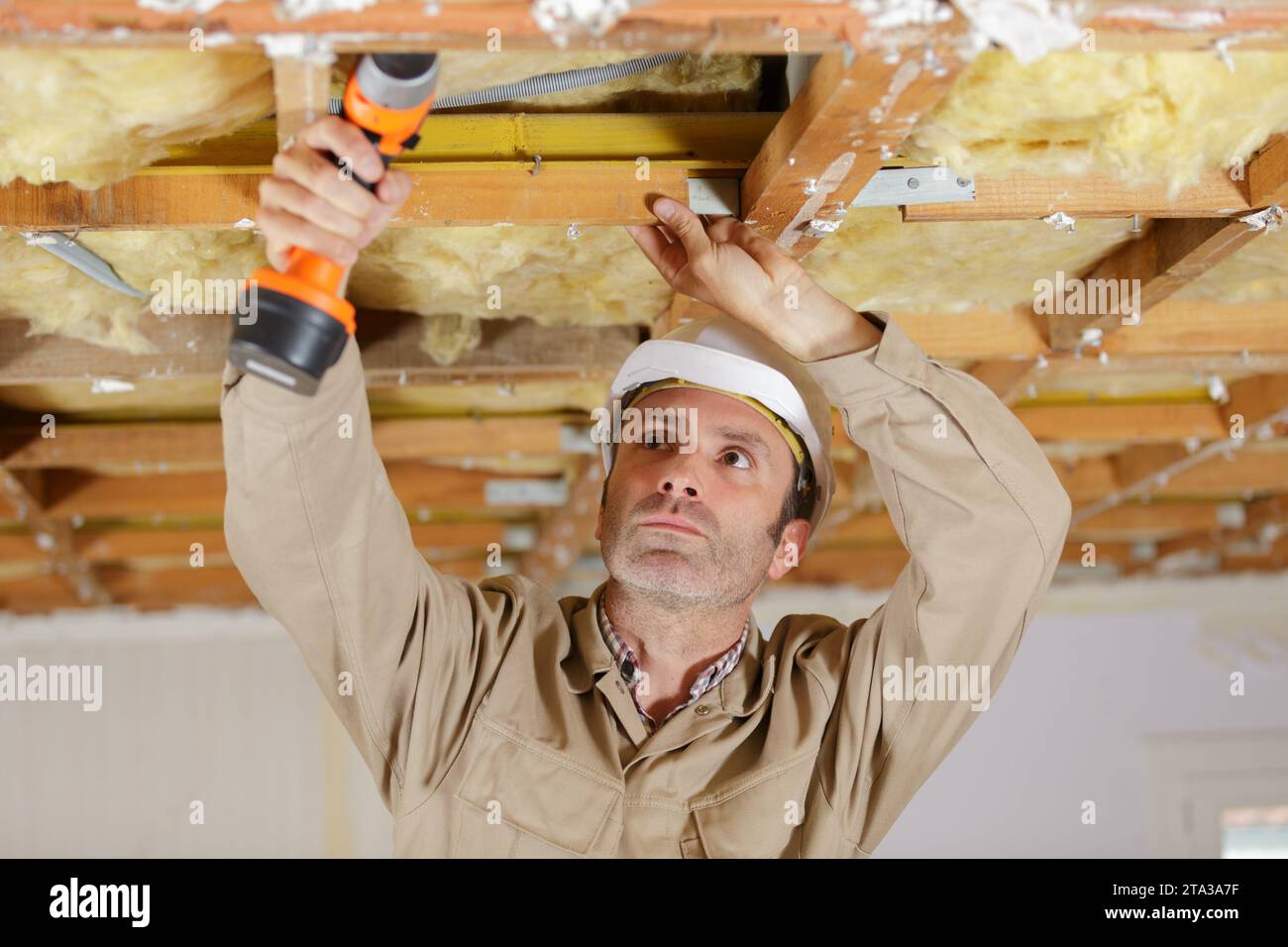 carpenter in a construction site Stock Photo - Alamy