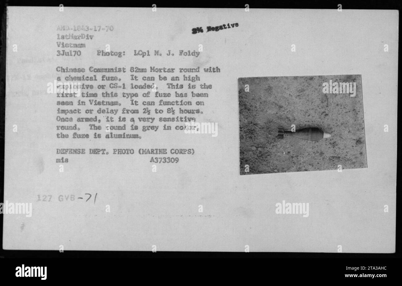 A Chinese Communist 82mm mortar round with a chemical fuze was captured during the Vietnam War. It could be loaded with high explosives or CS-1 gas. The fuze functioned on impact or with a delay of 2 to 8 hours. The round was grey with an aluminum fuze. Photo by LCpl M. J. Foldy. Stock Photo