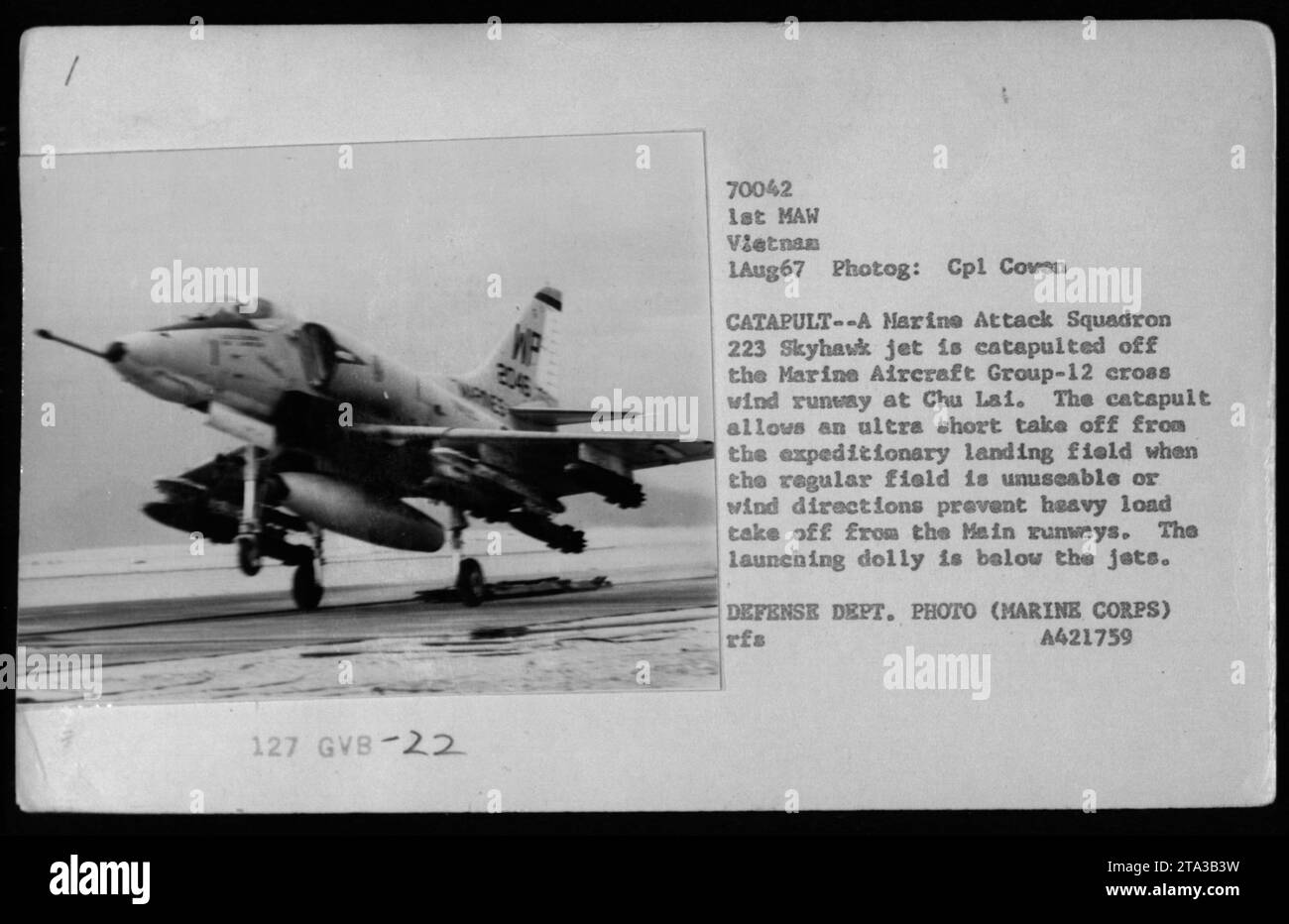 A Marine Attack Squadron 223 Skyhawk jet is catapulted off the crosswind runway at Chu Lai, Vietnam on August 1, 1967. The catapult allows for an ultra-short takeoff when the regular field is unusable or when wind directions prevent heavy load takeoffs from the main runways. The launching dolly is visible below the jets in the image. This photograph is an official Defense Department photo taken by Corporal Cowen. Stock Photo