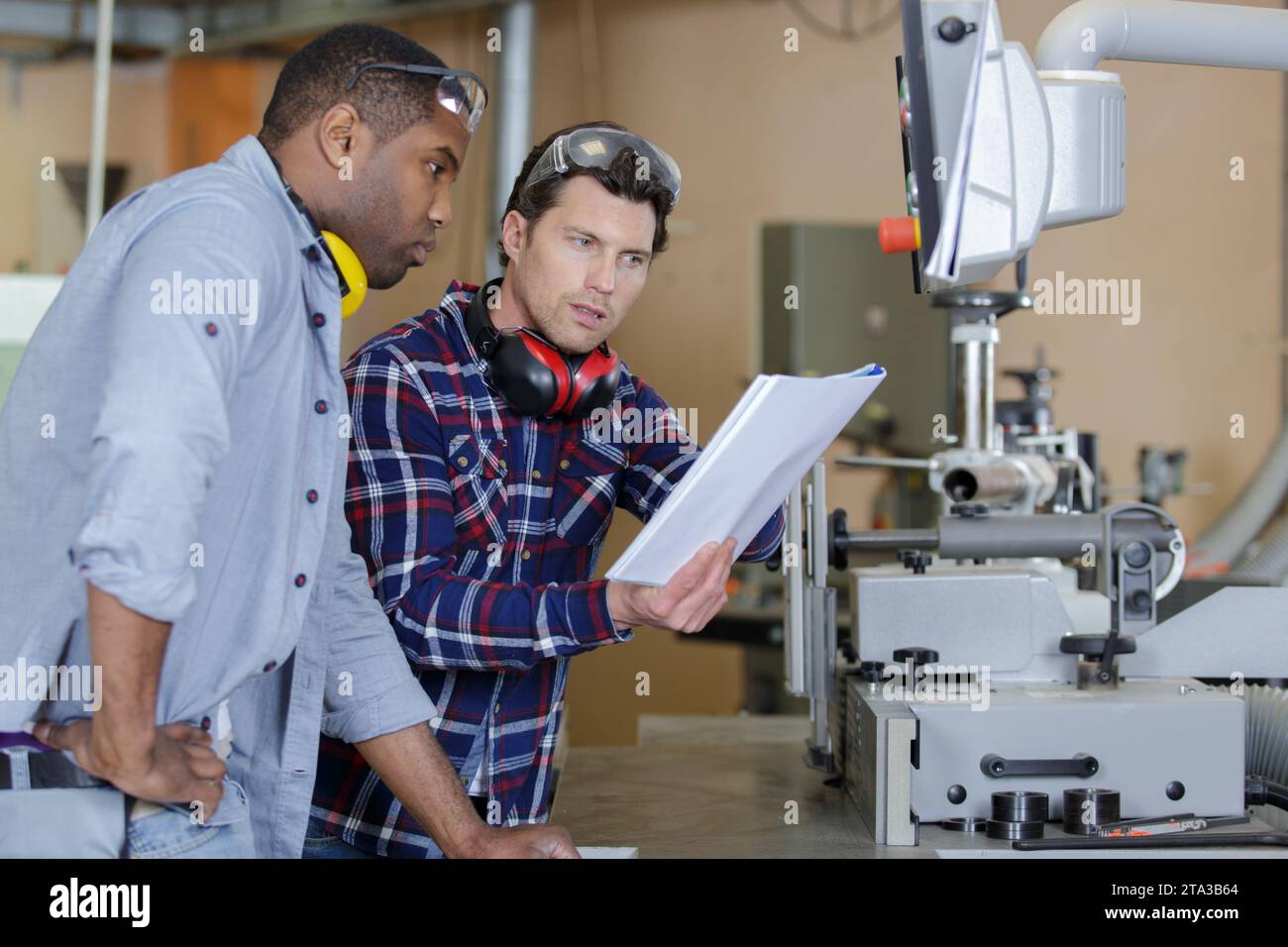 Two men using metal hi-res stock photography and images - Alamy