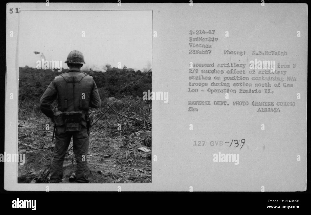 Forward artillery observer from F 2/9 monitors aftermath of artillery bombardment on enemy