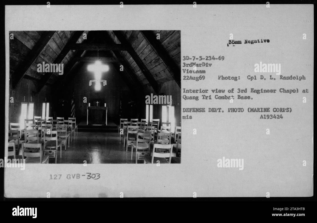 Interior view of the 3rd Engineer Chapel at Quang Tri Combat Base, taken on August 22, 1969. The photograph shows Terence Cardinal Cooke during a religious ceremony. This image is part of a collection documenting American military activities during the Vietnam War. Source: Defense Department Photo (Marine Corps), Mis A193424. Stock Photo