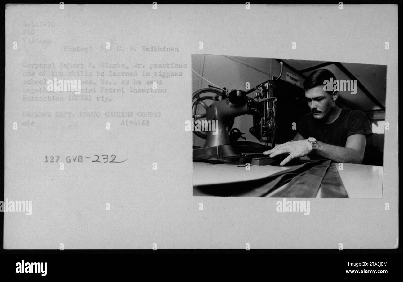 Corporal Robert A. Glarke, Jr. practices the techniques he learned in riggers school at Fort Lee, Virginia. In this photo, he is seen assembling a Special Patrol Insertion Extraction rig. The image was taken in 1970 by Sgt G. W. Beikkinen, a TEC photographer during the Vietnam War. Stock Photo