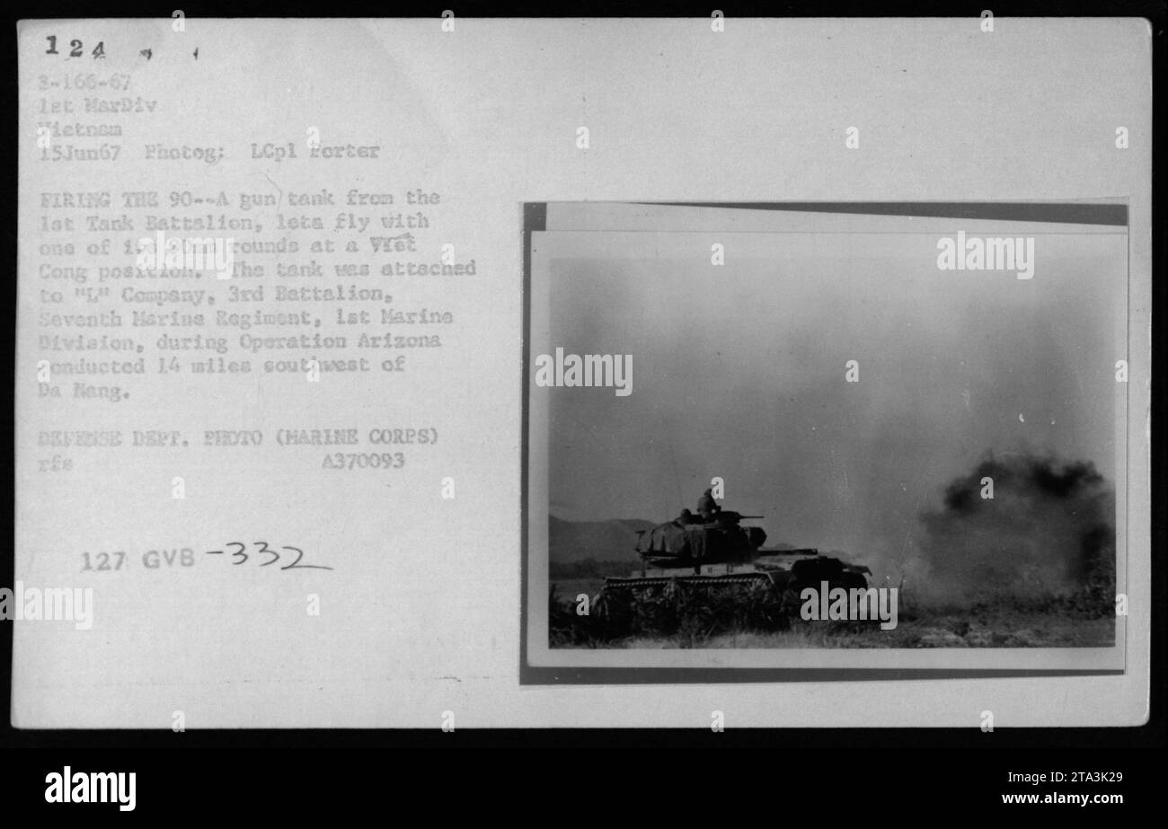 'Firing a 90mm gun, a tank from the 1st Tank Battalion, attached to 'L' Company, 3rd Battalion, Seventh Marine Regiment, 1st Marine Division, is seen engaging a Viet Cong position during Operation Arizona on June 15, 1967. The operation took place 14 miles southwest of Da Nang. Defense Department photo by LCpl Porter, Marine Corps. A370093. (#332)' Stock Photo