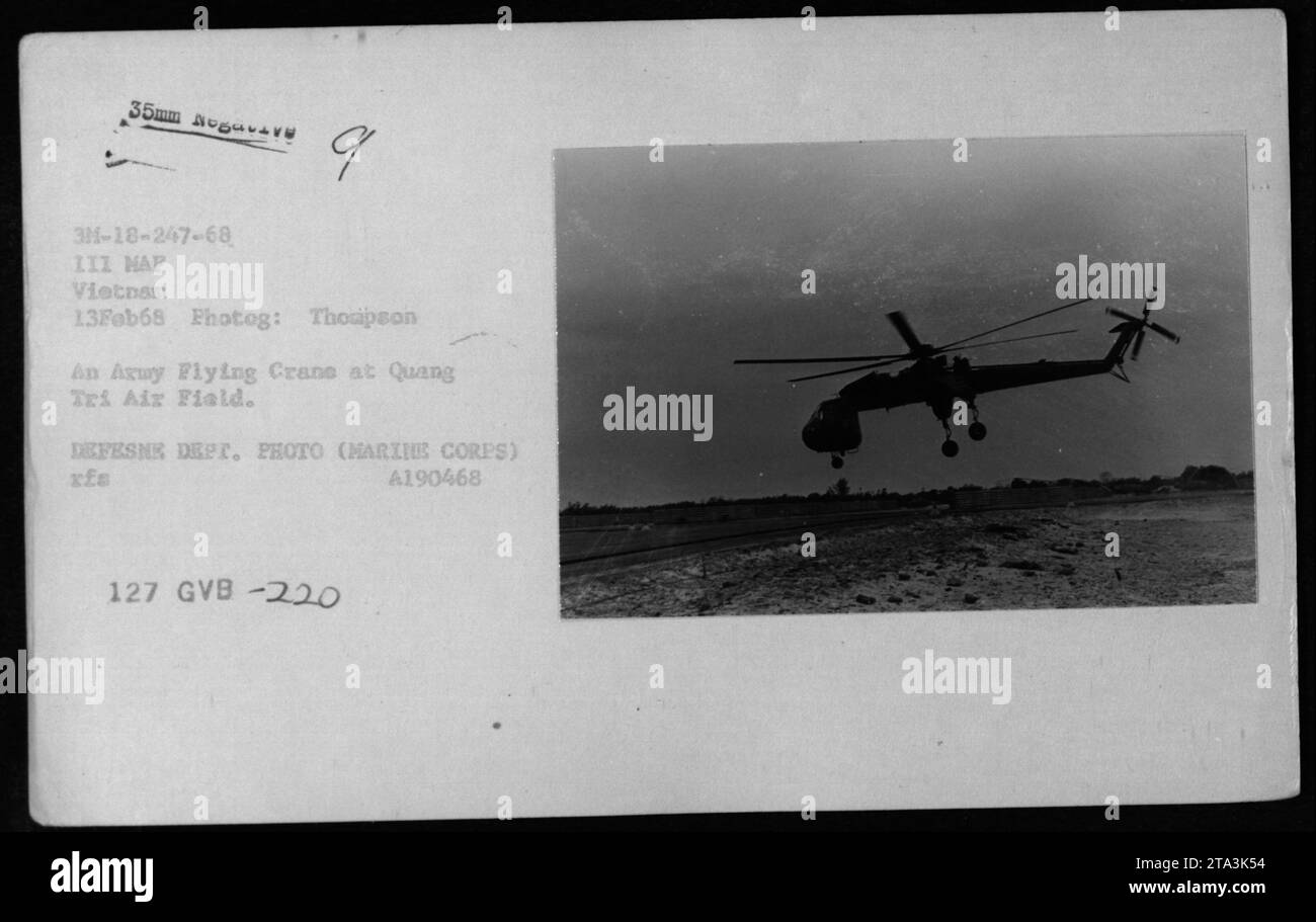 An CH-54 helicopter, also known as the Flying Crane, is seen at Quang Tri Air Field in Vietnam on February 13, 1968. This photograph was taken by Thompson from the III MAF (III Marine Amphibious Force). Image ref: A 3M-18-247-68 111 HAP ve 9 Vietnam 13Feb68. It is part of the Defense Department's photo collection (Marine Corps) with the reference number A190468. Stock Photo