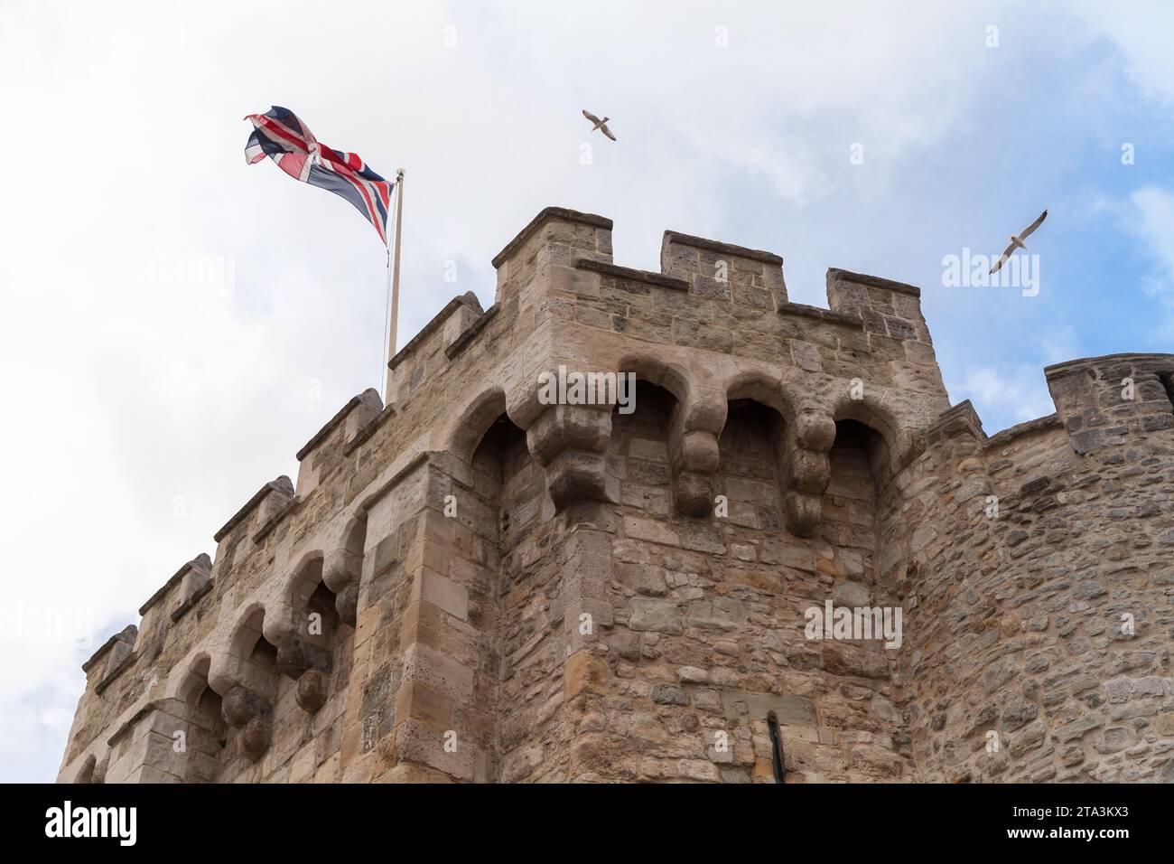 British flag is on the top of the Bargate, a medieval gatehouse in the city of Southampton, England. Constructed in Norman times as part of the Southa Stock Photo