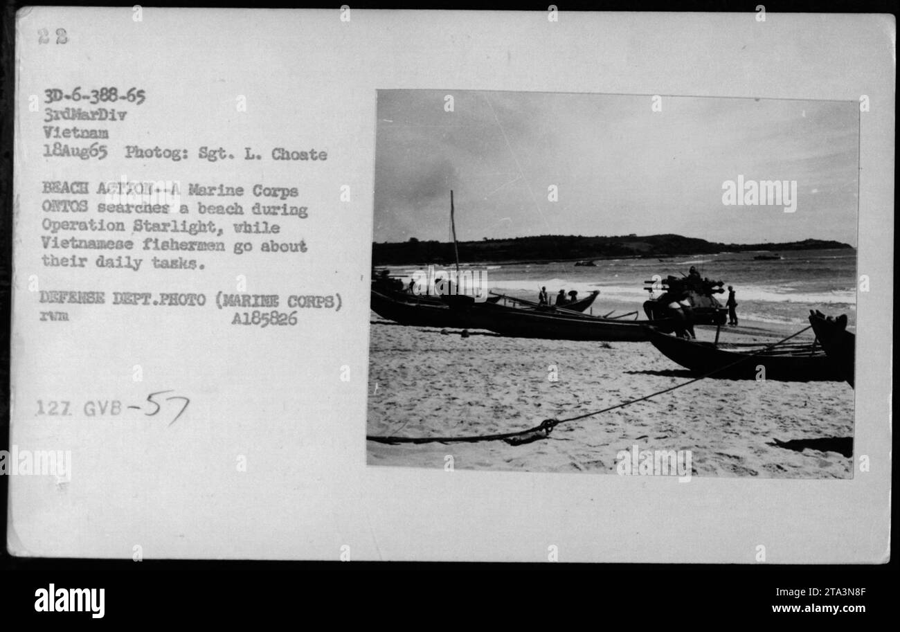 A Marine Corps ONTOS vehicle conducting a search on a beach during Operation Starlight, while Vietnamese fishermen continue their daily tasks. This image was captured on August 18, 1965, by Sgt. L. Choate of the 3rd Marine Division in Vietnam. Defense Department Photo (Marine Corps) A185826, reference number 3D-6-388-65 and GVB-57. Stock Photo