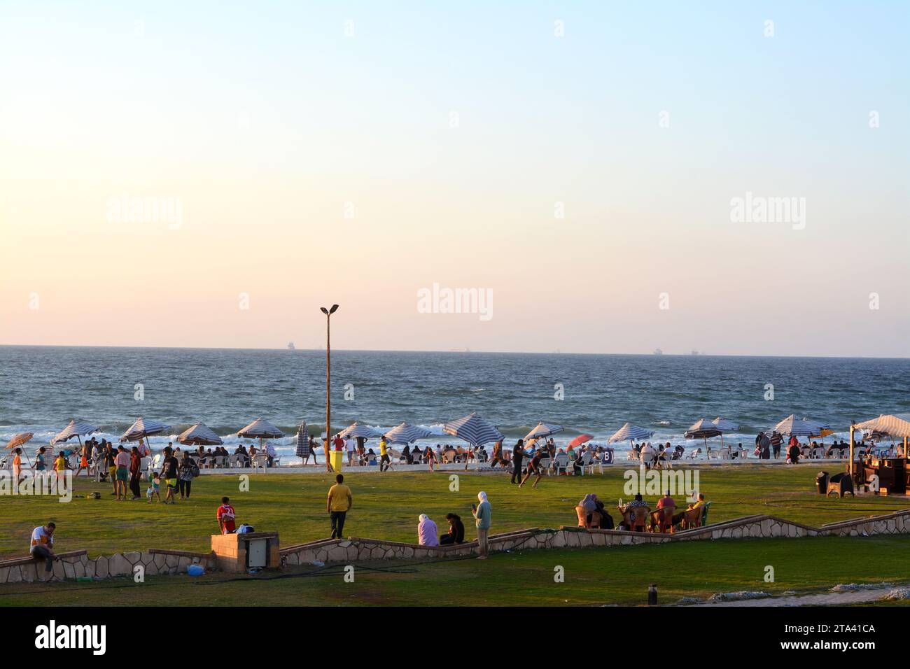 Alexandria, Egypt, September 9 2022: Alexandria beach, with people on the shore having fun and enjoying their holiday summertime, with the Mediterrane Stock Photo