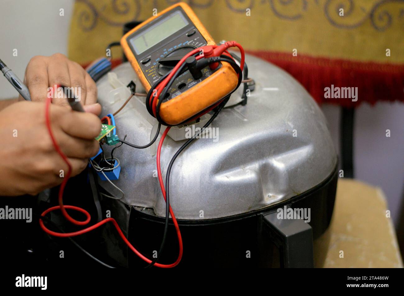 Cairo, Egypt, November 7 2023 an air fryer maintenance, repair, An air