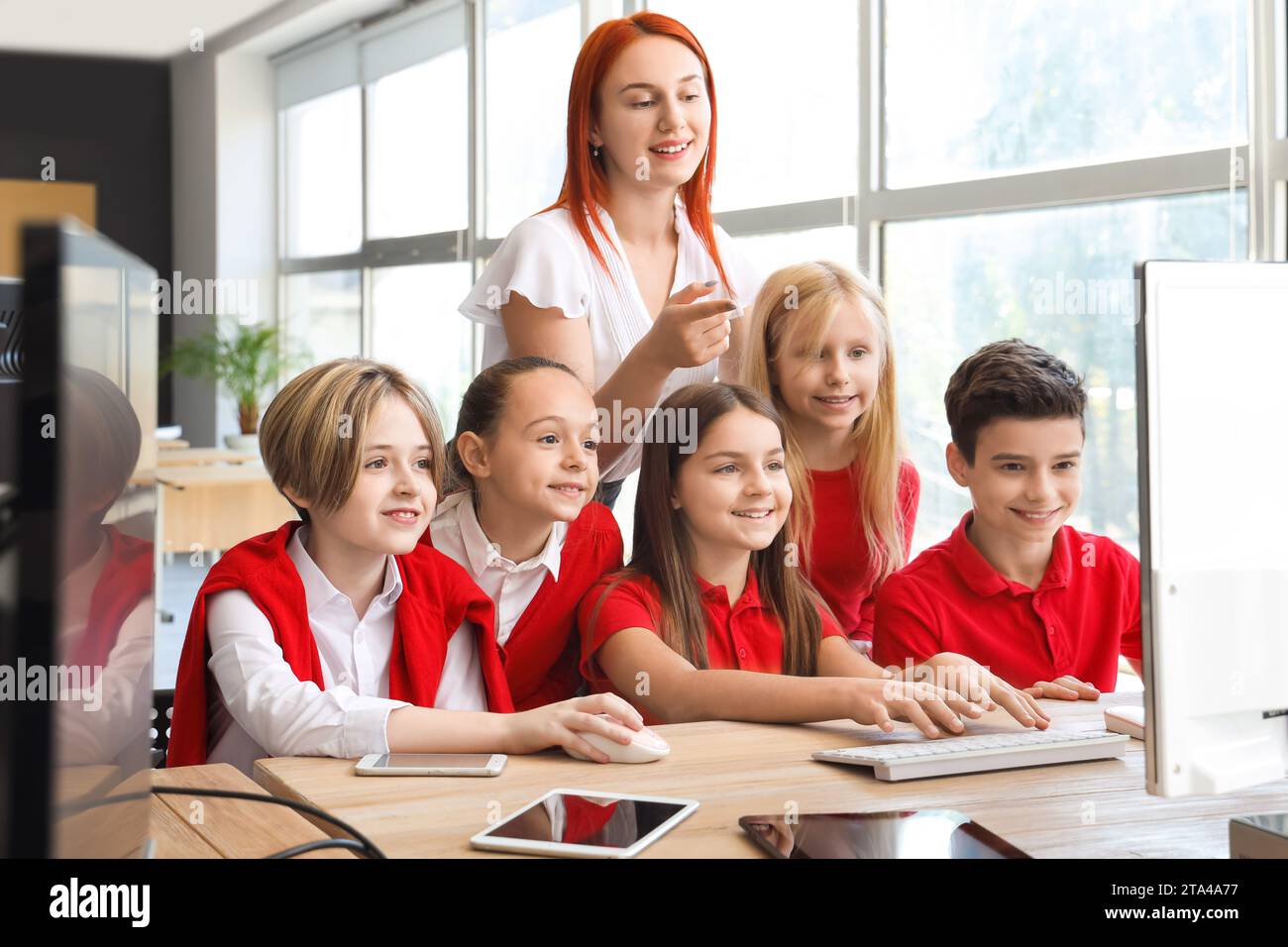Little children with teacher studying at school computer lab Stock ...