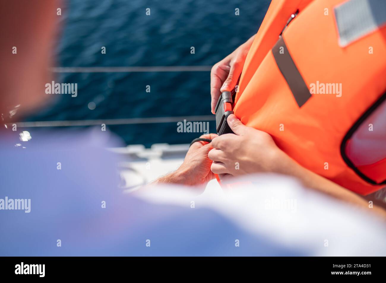 Person wearing a life jacket hi-res stock photography and images - Alamy