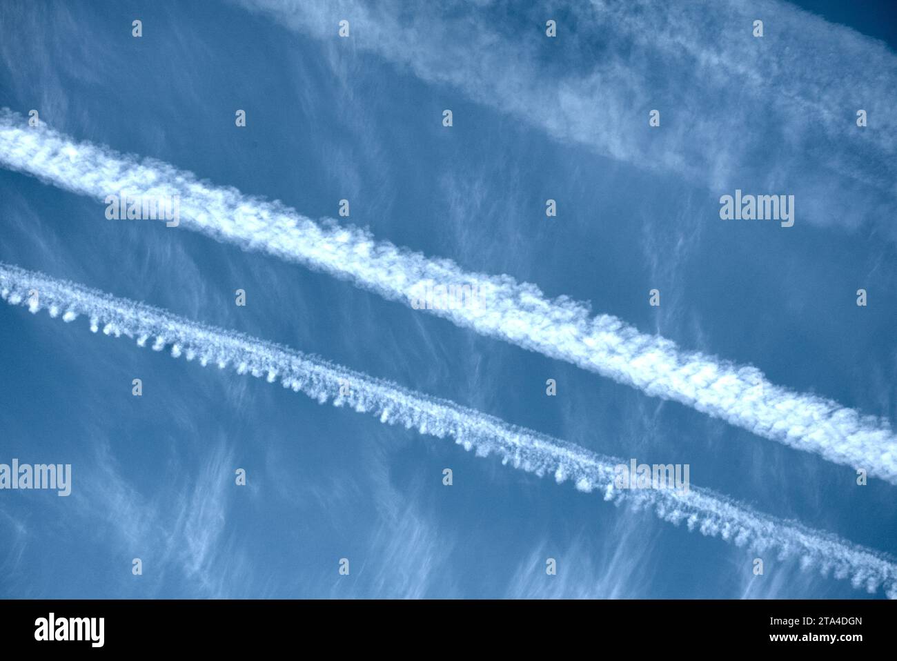Chemtrails on a sunny day Stock Photo