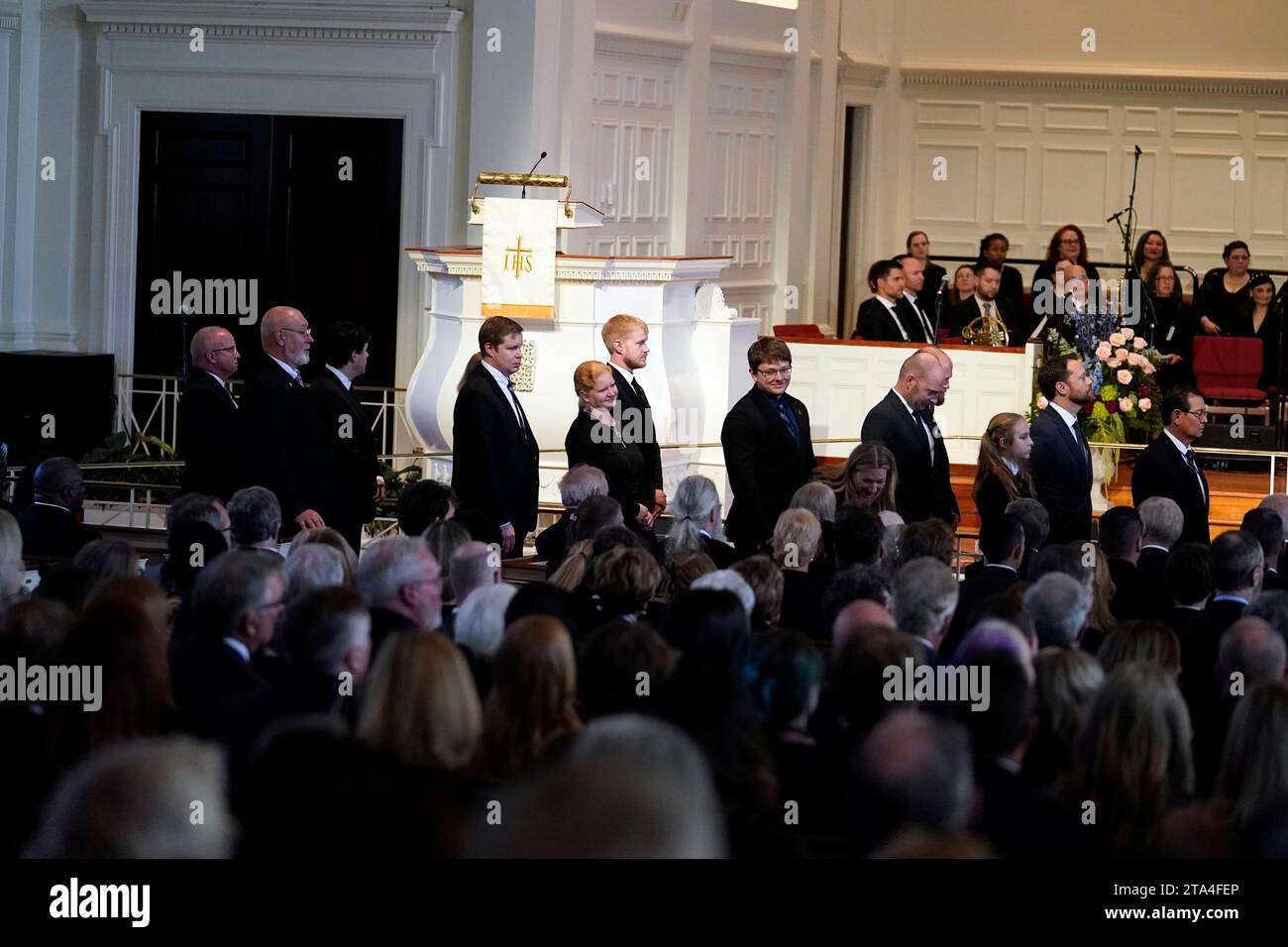 Atlanta, United States. 28th Nov, 2023. Carter family members watch as an Armed Forces body bearer team moves the casket of former first lady Rosalynn Carter after a tribute service at Glenn Memorial Church at Emory University on Tuesday, November 28, 2023, in Atlanta, Georgia. Pool Photo by Brynn Anderson/UPI Credit: UPI/Alamy Live News Stock Photo