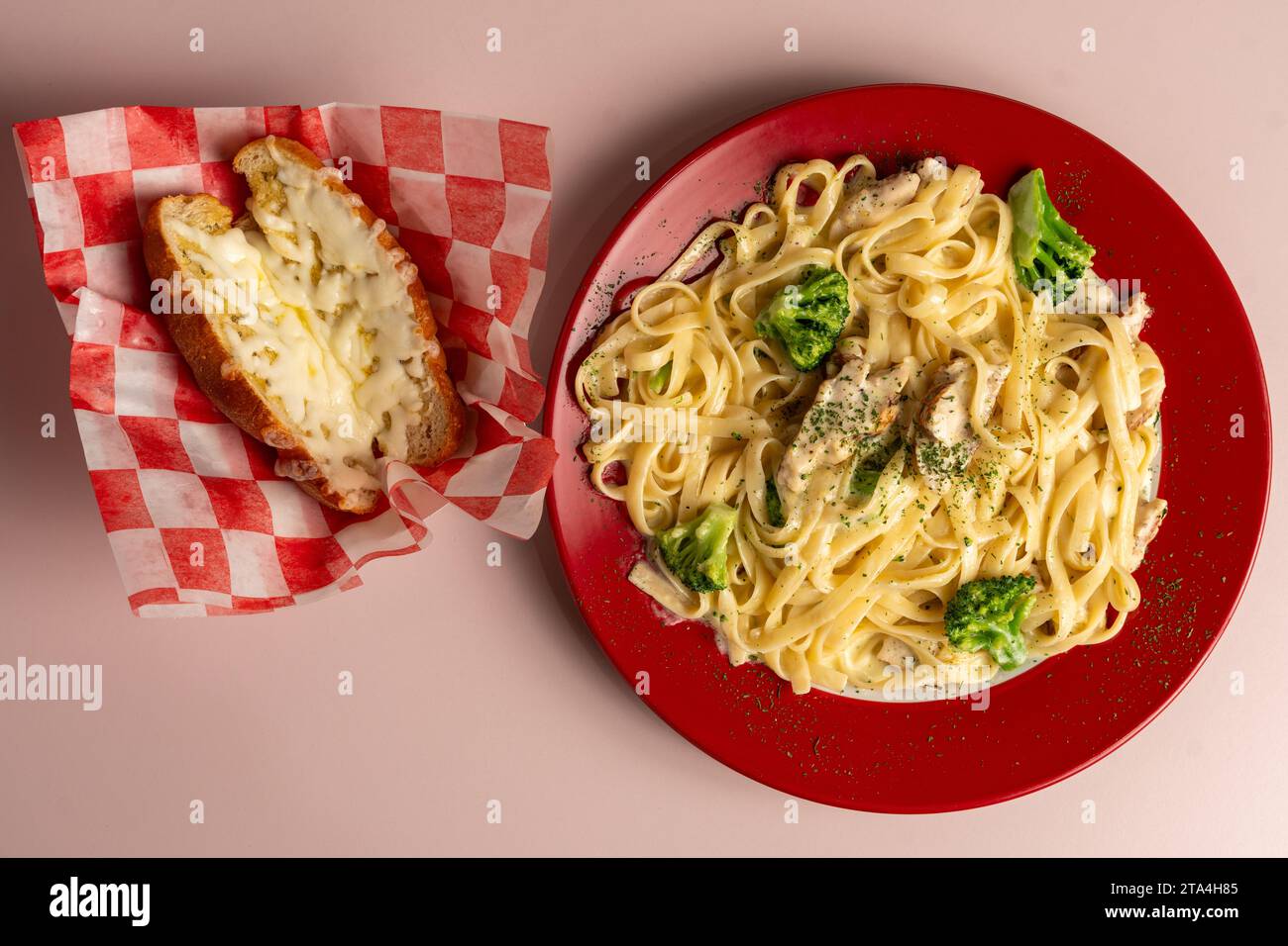 Fettuccine Alfredo with garlic bread Stock Photo Alamy
