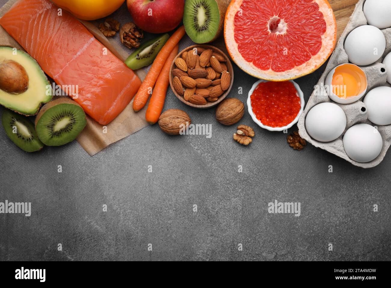 Many different products on brown table, flat lay with space for text. Natural sources of serotonin Stock Photo