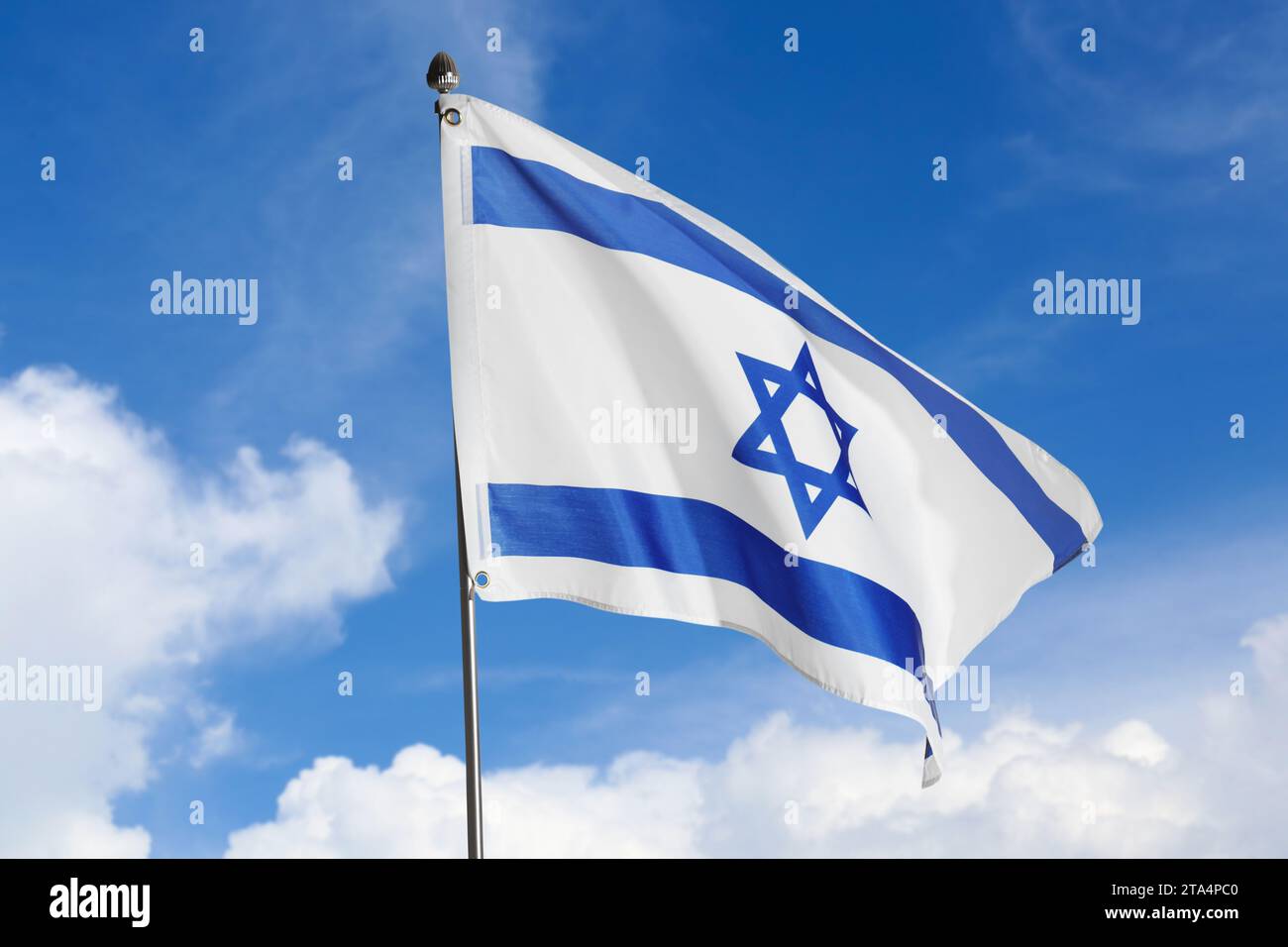 National flag of Israel against blue sky with clouds Stock Photo - Alamy
