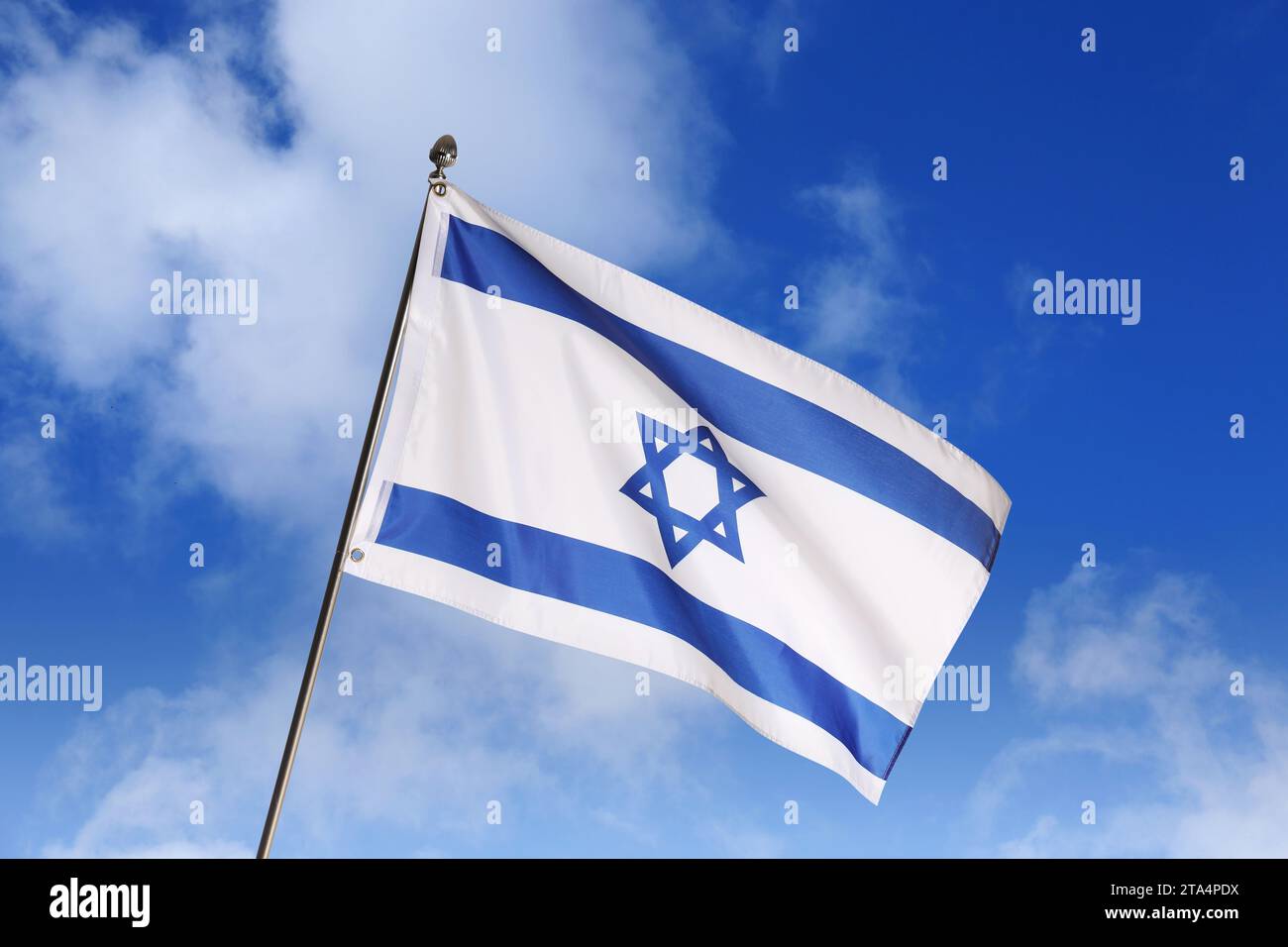 National flag of Israel against blue sky with clouds Stock Photo - Alamy