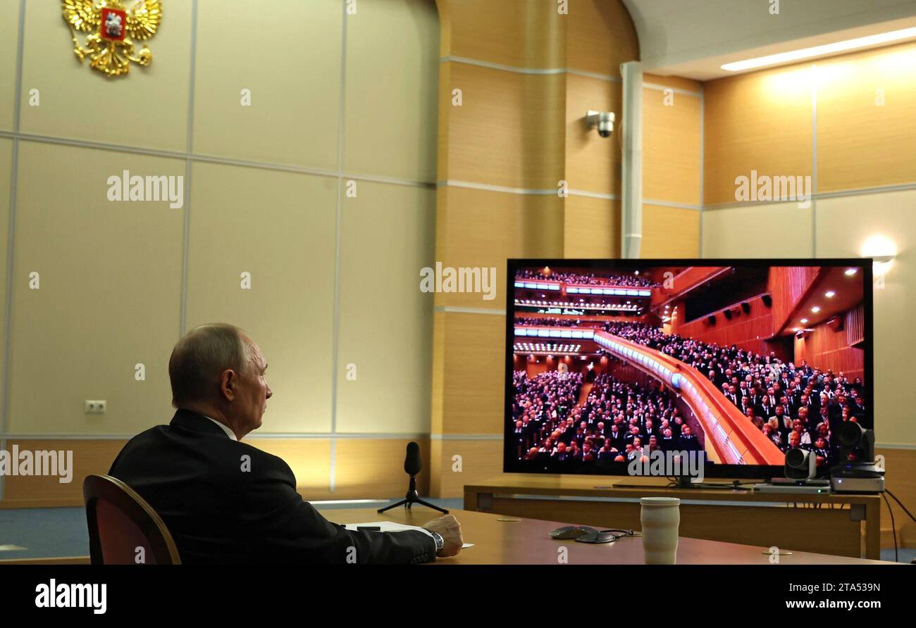 Sochi, Russia. 28th Nov, 2023. Russian President Vladimir Putin, left, listens to listens via videoconference to the plenary session of the World Russian People's Council from his Black Sea residence, November 28, 2023 in Sochi, Russia. Credit: Mikhail Klimentyev/Kremlin Pool/Alamy Live News Stock Photo
