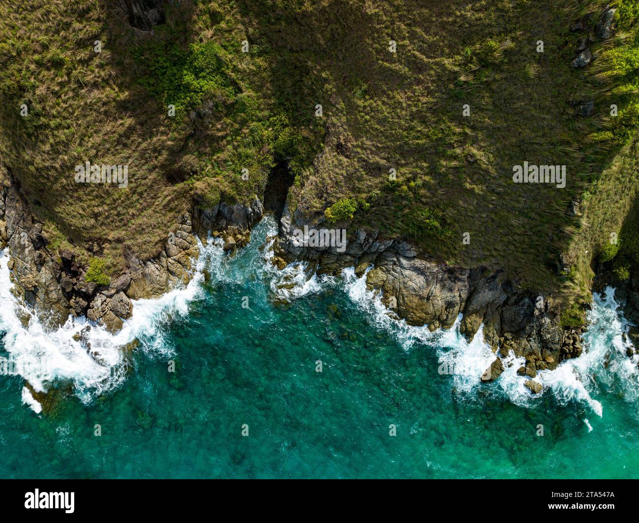 Bird eye view seashore with big wave crashing on rock cliff. Beautiful ...