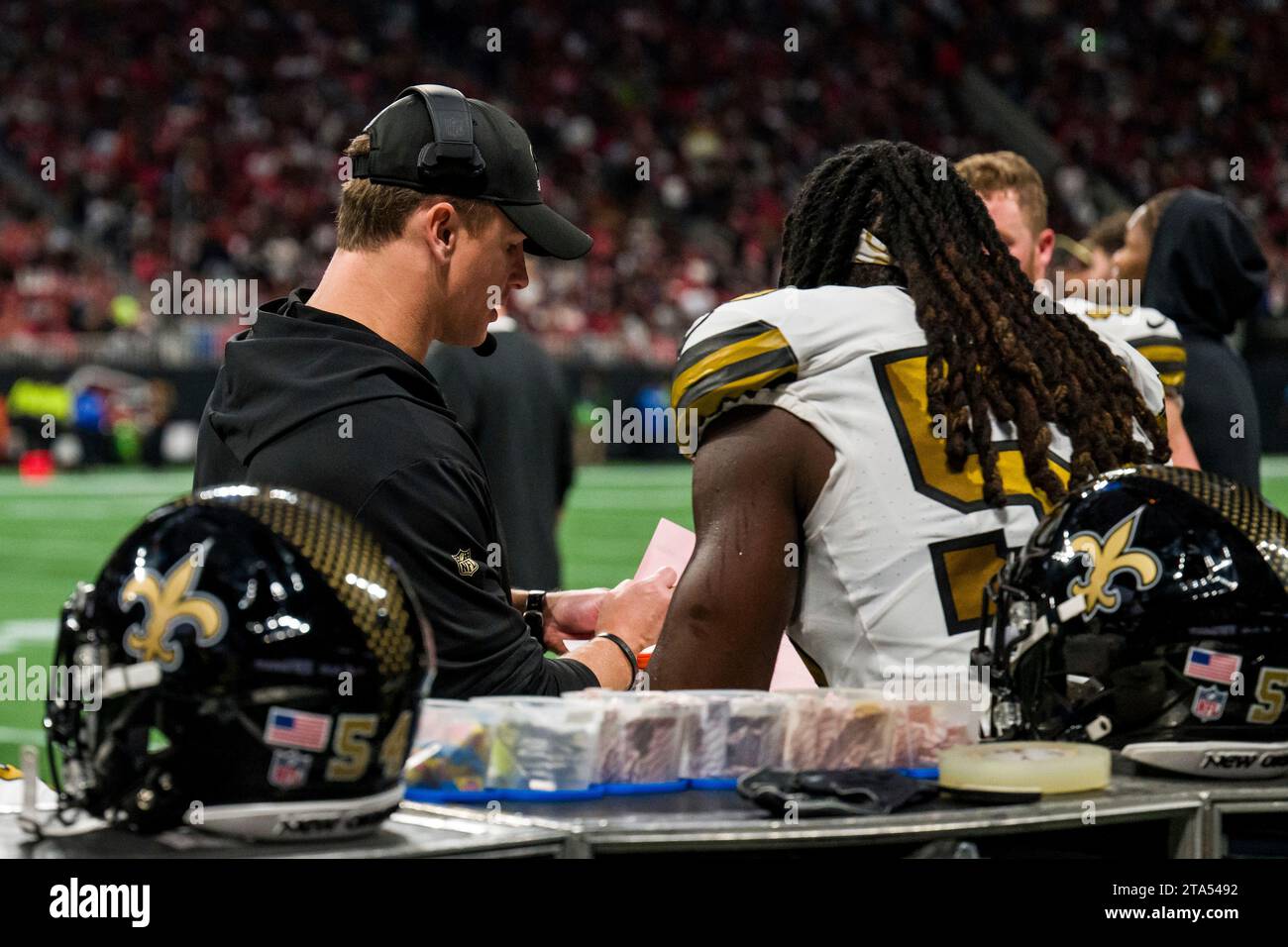 New Orleans Saints linebackers coach Michael Hodges speaks with