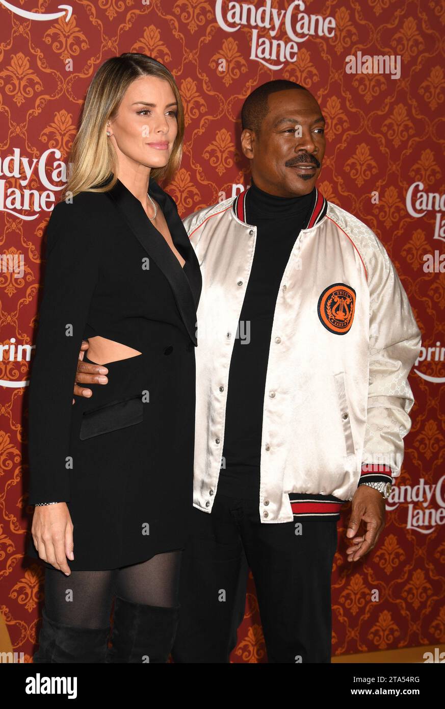 Los Angeles, Ca. 28th Nov, 2023. Paige Butcher and Eddie Murphy at the