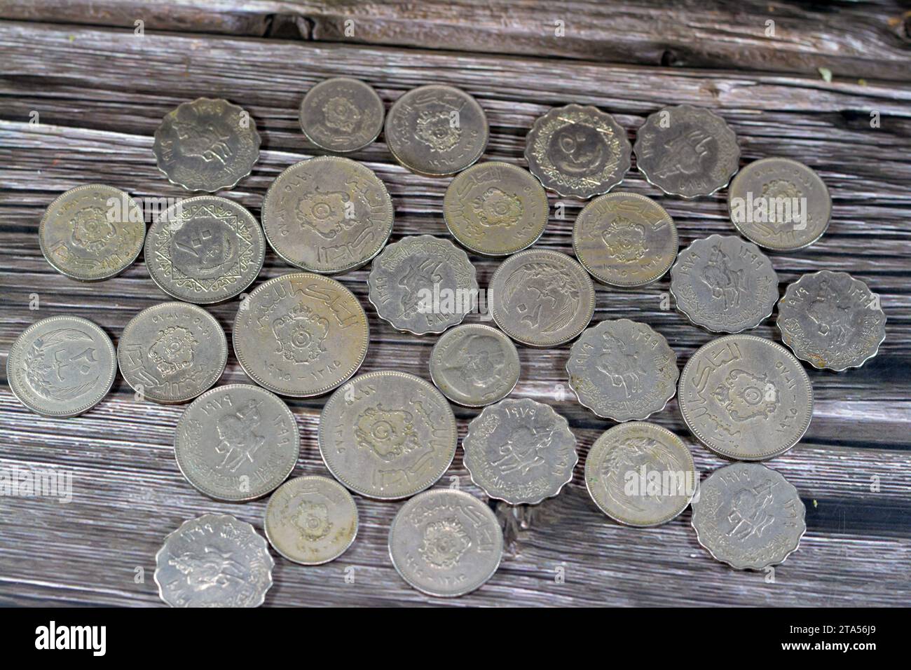 Old Libyan money coins of different eras from the kingdom to Jamahiriya of Libya times, vintage retro old Libyan currency, value, exchange rate of Lib Stock Photo