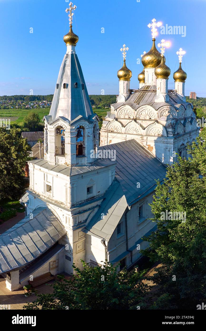 Aerial view of an ancient Orthodox church with golden crosses and domes