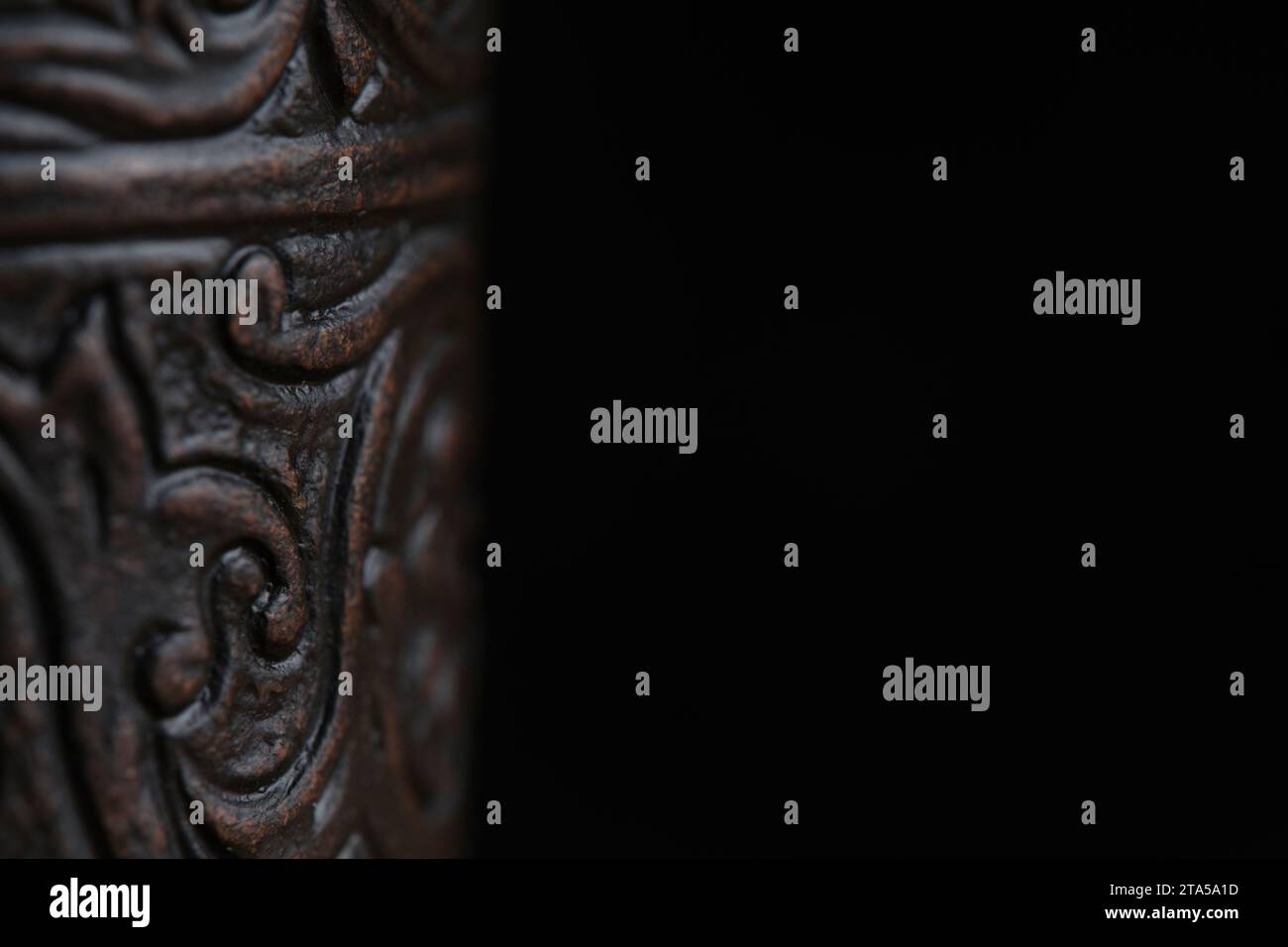 Antique copper vessel with an ornament black background Stock Photo - Alamy