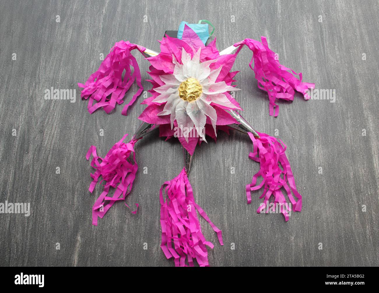 Mexican Paper Flowers and Pinata Stock Photo - Alamy