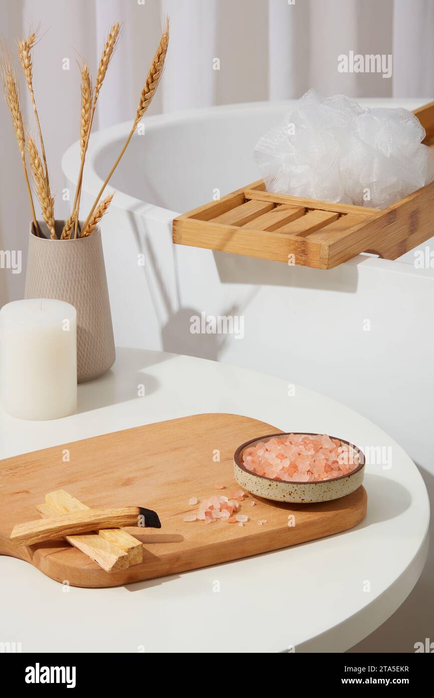 Wooden chopping board featured a dish of pink himalayan salt and some